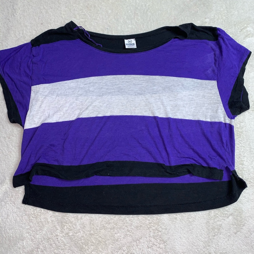 PINK black white and purple striped belly shirt.